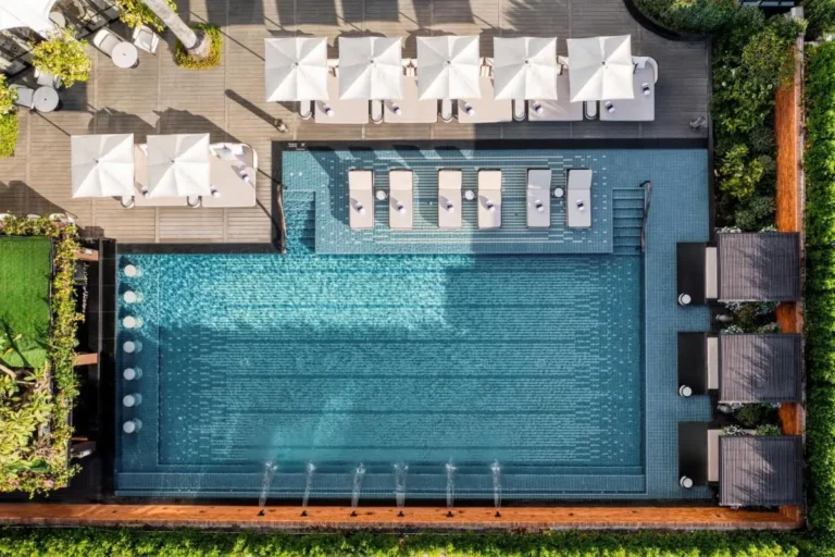 Outdoor Rectangular Swimming Pool with Lounge Chairs and Water Jets in Chang Khlan Chiang Mai