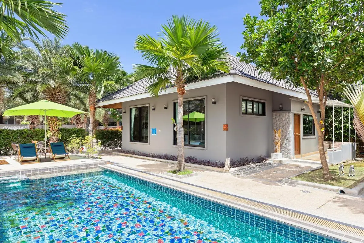 Outdoor Rectangular Swimming Pool with Mosaic Tiles and Lounge Area at Rawai Beach