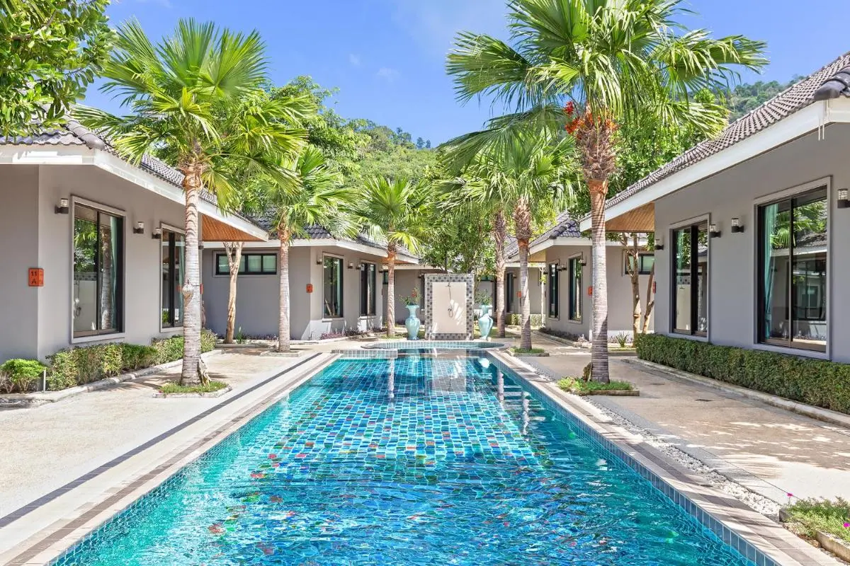 Outdoor Rectangular Swimming Pool with Mosaic Tiles and Palm Trees at Rawai Beach