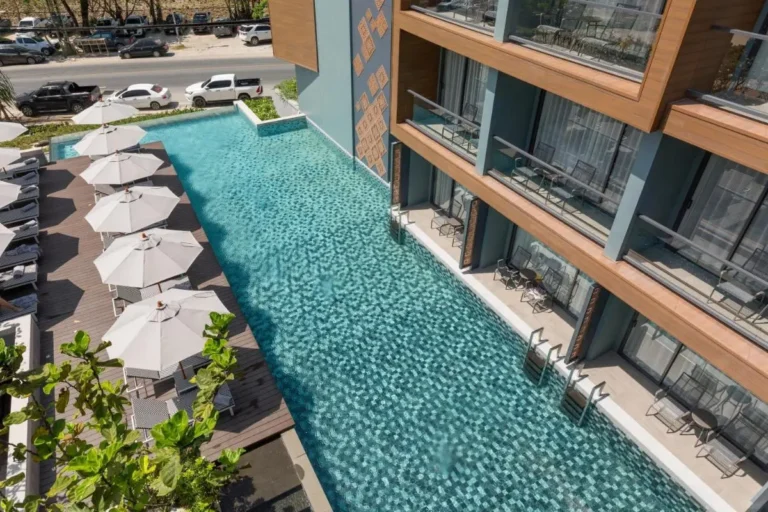Outdoor Rectangular Swimming Pool with Mosaic Tiles and Poolside Loungers at Patong Beach