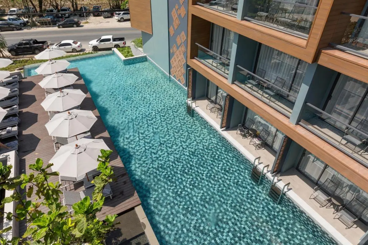 Outdoor Rectangular Swimming Pool with Mosaic Tiles and Poolside Loungers at Patong Beach