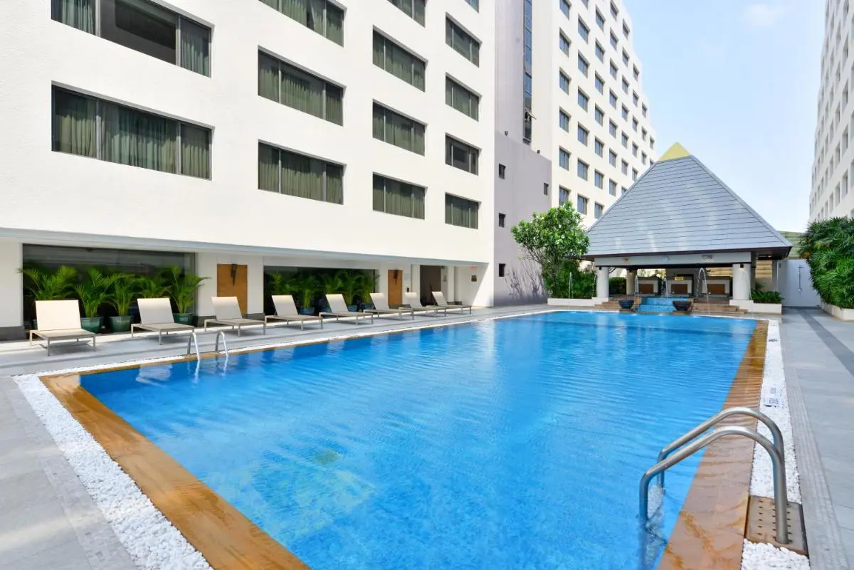 Twin Towers Hotel Outdoor Rectangular Swimming Pool with Pavilion and Lounge Chairs in Pathumwan Bangkok