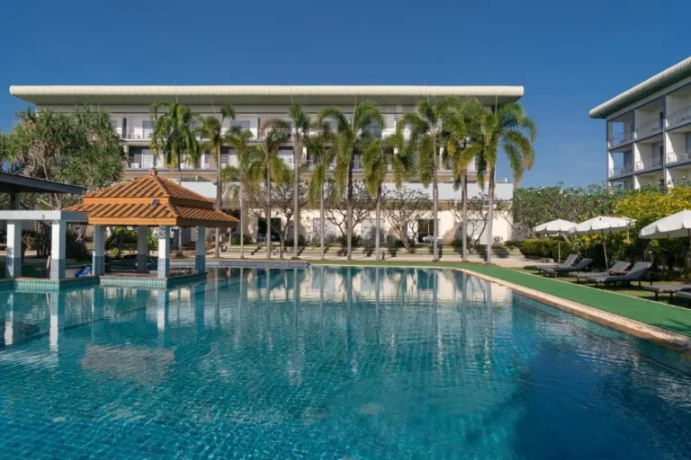 Outdoor Rectangular Swimming Pool with Shaded Seating and Lounge Area at Rawai Beach