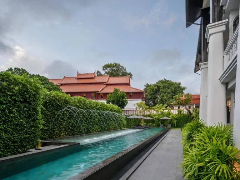Outdoor Rectangular Swimming Pool with Water Jets and Lounge Area in Phra Sing Chiang Mai