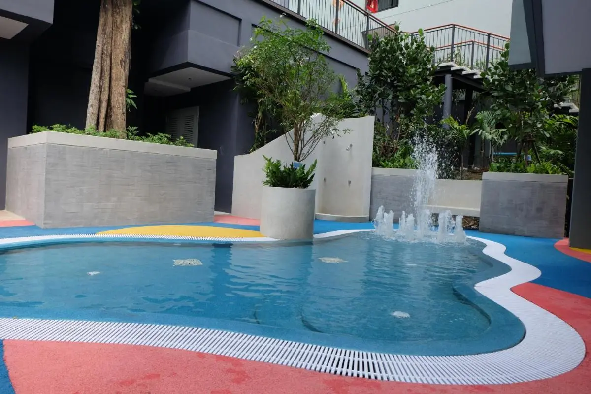 Outdoor Relaxation Pool with Water Jets and Shower Area in Patong Beach Courtyard