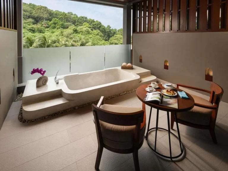 Outdoor Stone Bathtub with Wooden Seating Area and Natural Views at Patong Beach