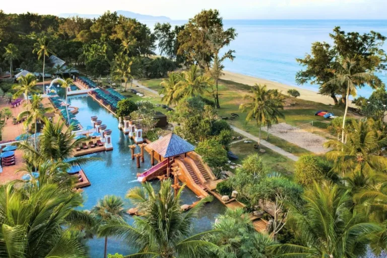 Outdoor Swimming Pool and Beachfront Recreation Area at Mai Khao Beach
