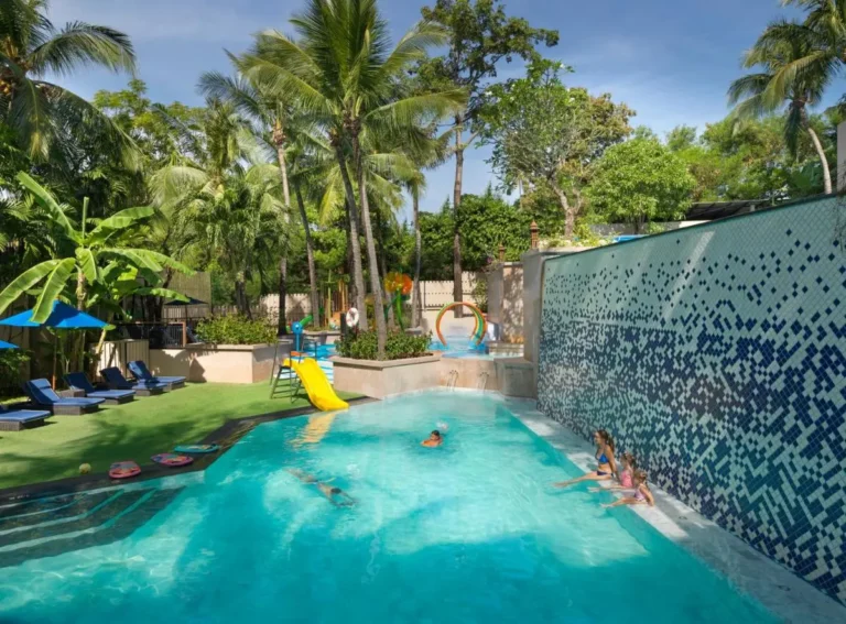 Outdoor Swimming Pool and Children’s Water Play Area Surrounded by Tropical Vegetation at Kata Beach