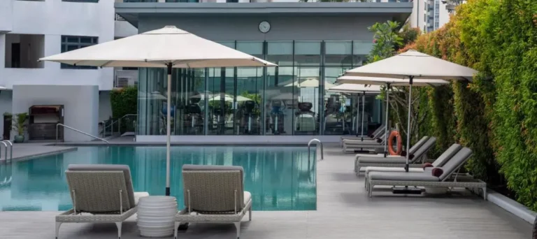 Outdoor Swimming Pool and Fitness Area with Lounge Seating in Singapore