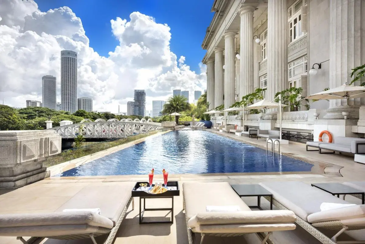 Outdoor Swimming Pool and Lounge Area with City Views in Marina Bay