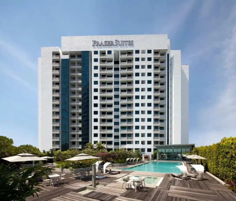 Outdoor Swimming Pool and Lounge Area with Glass-Enclosed Facility in Singapore
