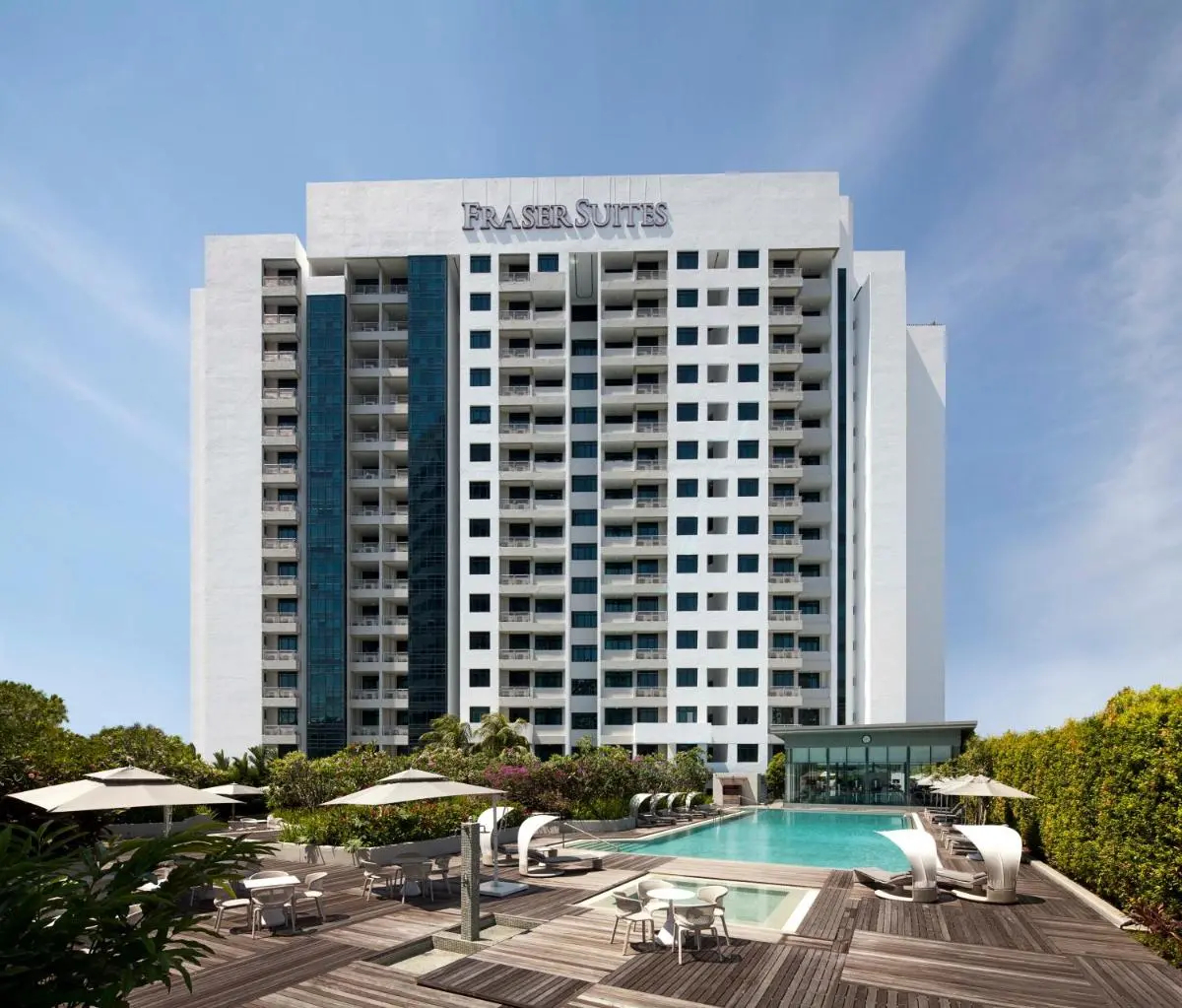 Outdoor Swimming Pool and Lounge Area with Glass-Enclosed Facility in Singapore