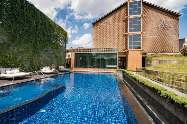 Outdoor Swimming Pool and Lounge Area with Greenery in Phra Sing Chiang Mai