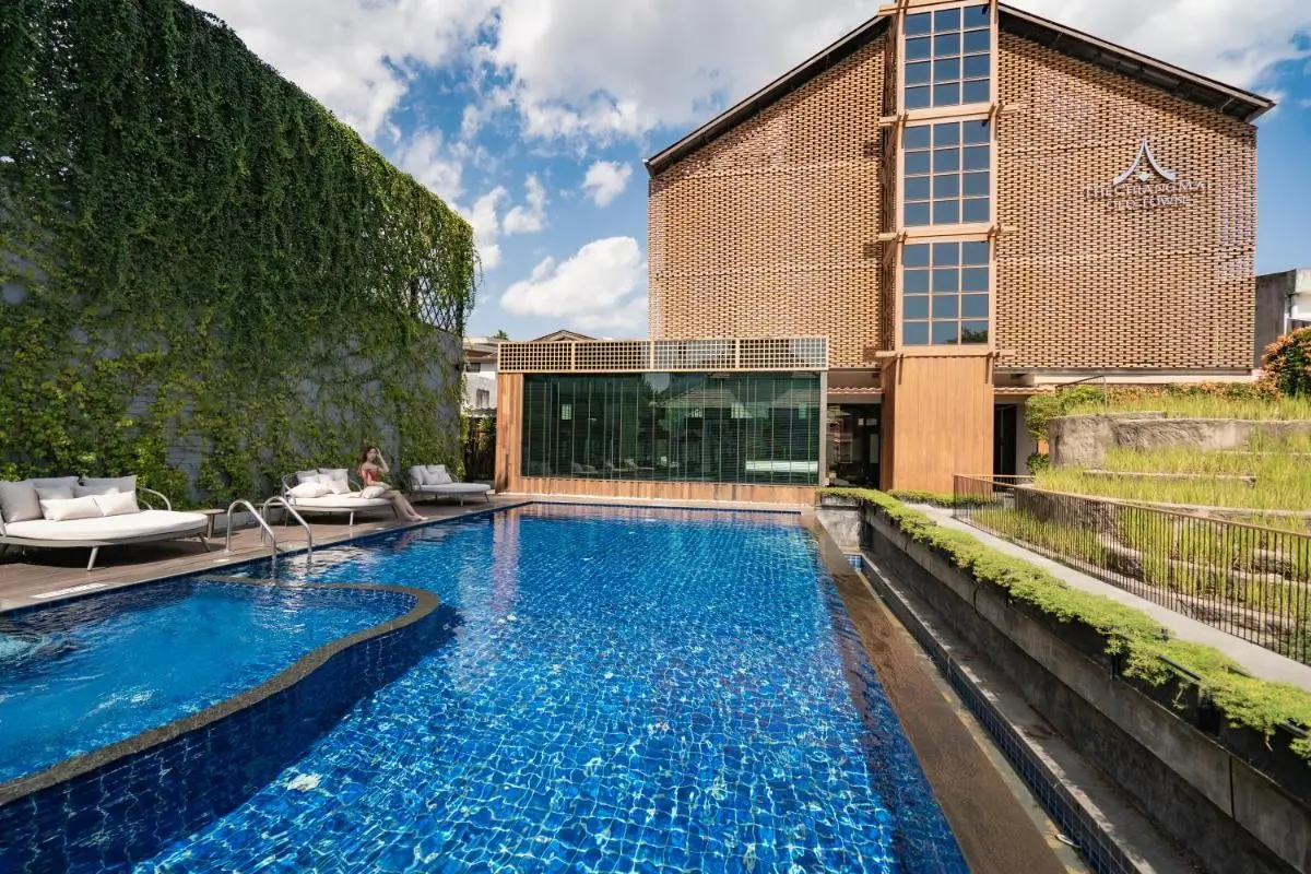 Outdoor Swimming Pool and Lounge Area with Greenery in Phra Sing Chiang Mai