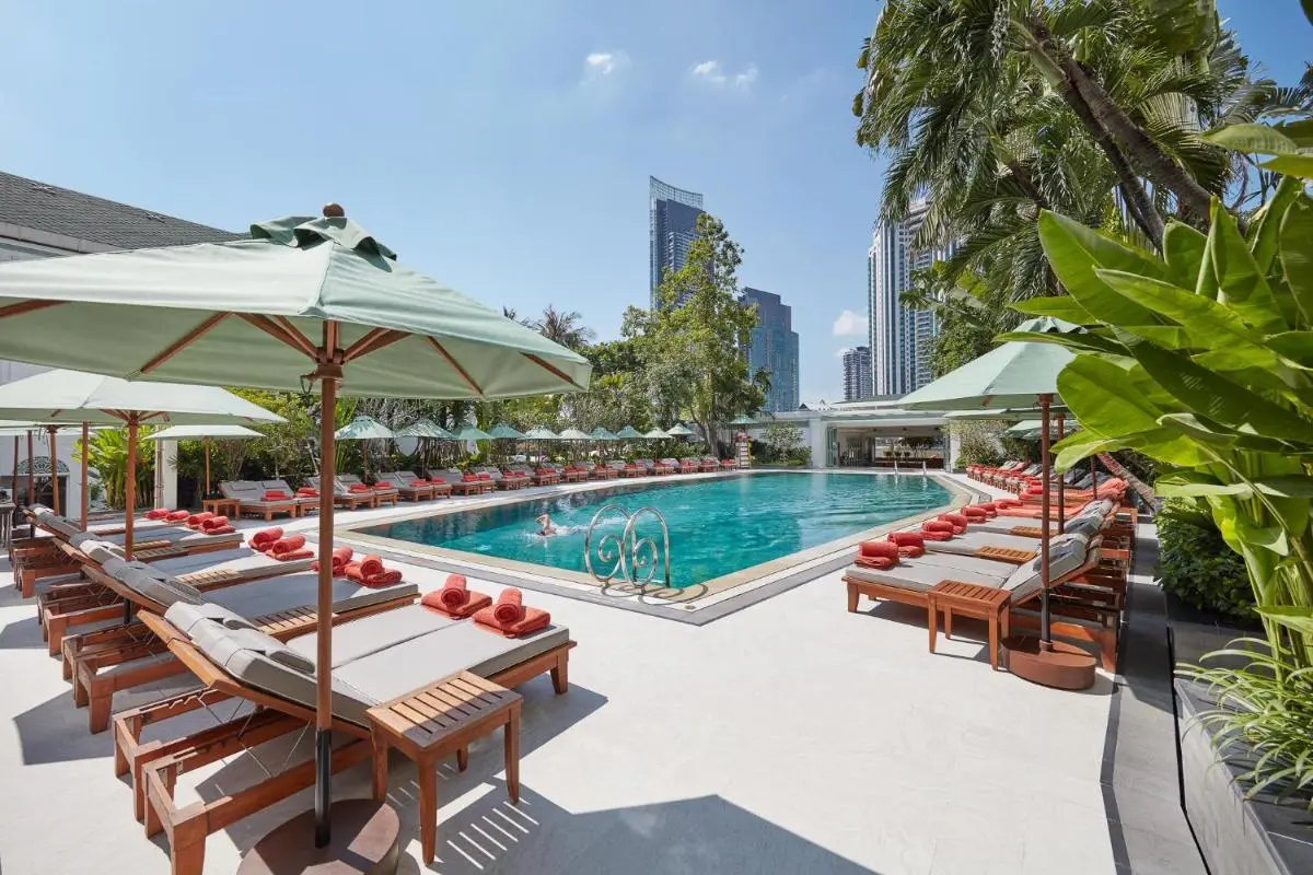 Outdoor Swimming Pool and Lounge Area with Tropical Surroundings in Bang Rak