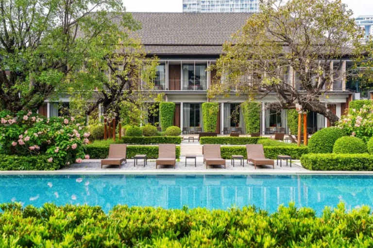 Outdoor Swimming Pool and Relaxation Area with Lounge Chairs in Sathorn City