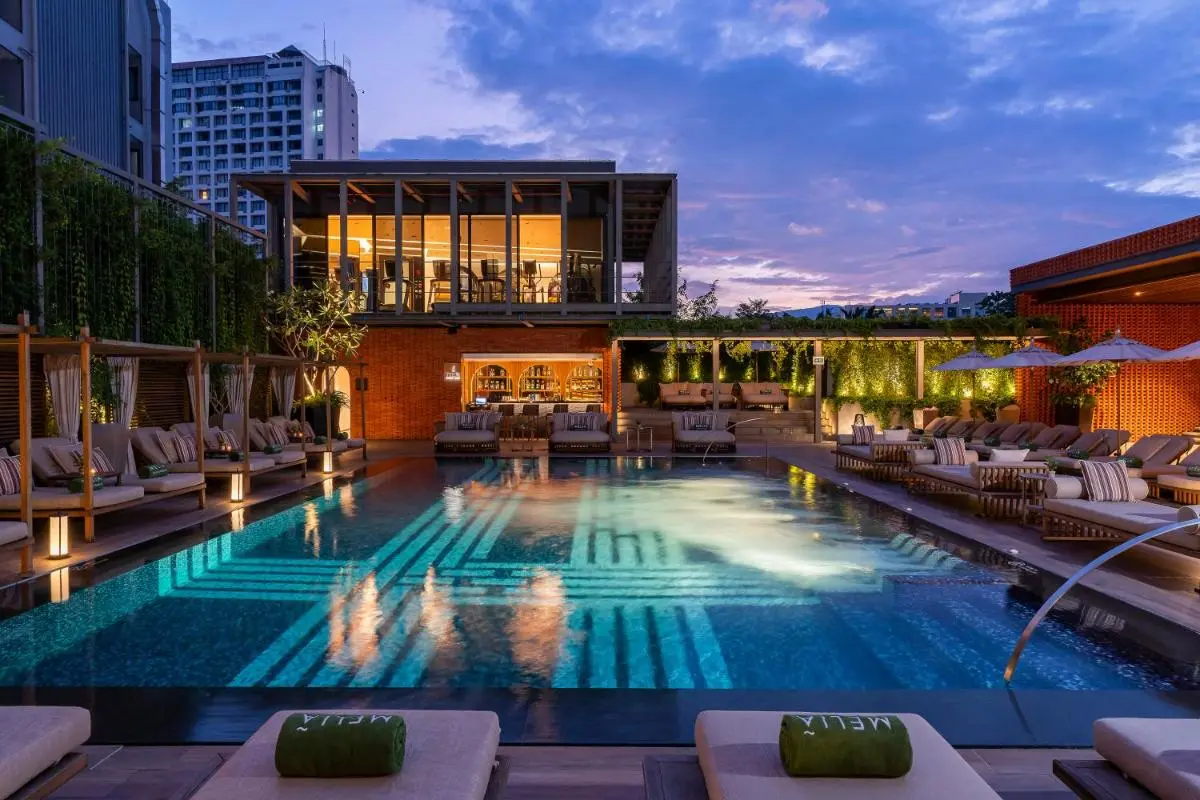 Melia Chiang Mai Outdoor Swimming Pool and Relaxation Area with Lounge Seating in Chang Khlan Chiang Mai