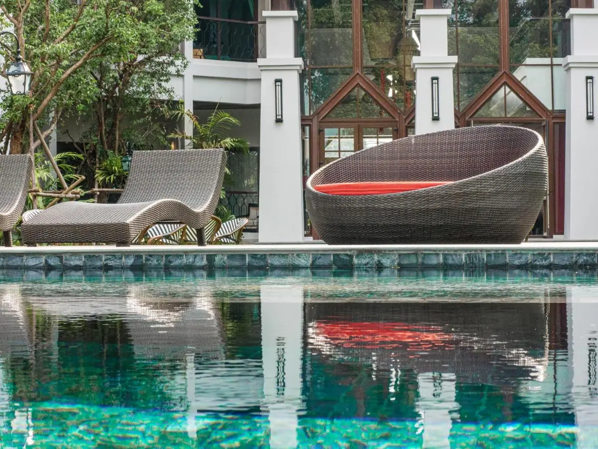 Outdoor Swimming Pool and Relaxation Area with Modern Seating in Fa Ham Chiang Mai