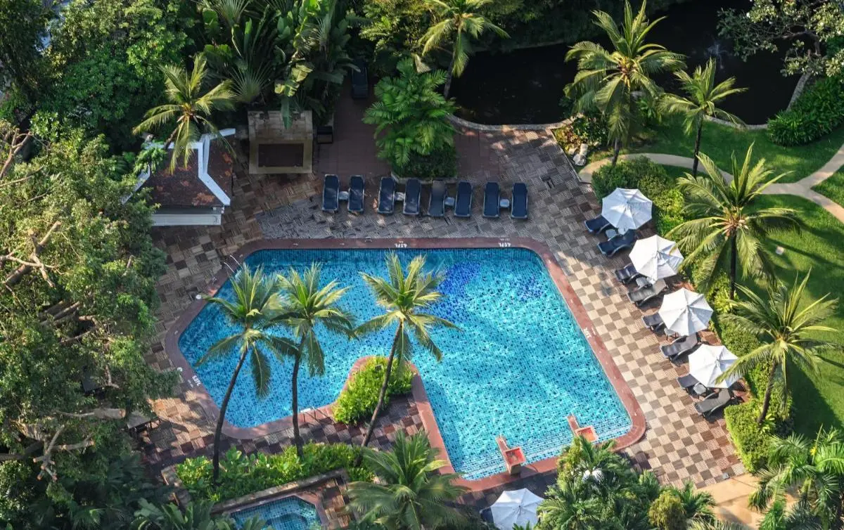 Outdoor Swimming Pool and Spa Area with Lounge Chairs and Tropical Landscaping in Chatuchak