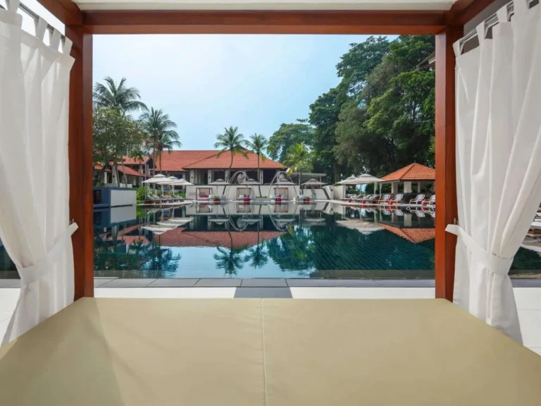 Outdoor Swimming Pool Area with Cabanas and Lounge Seating in Singapore
