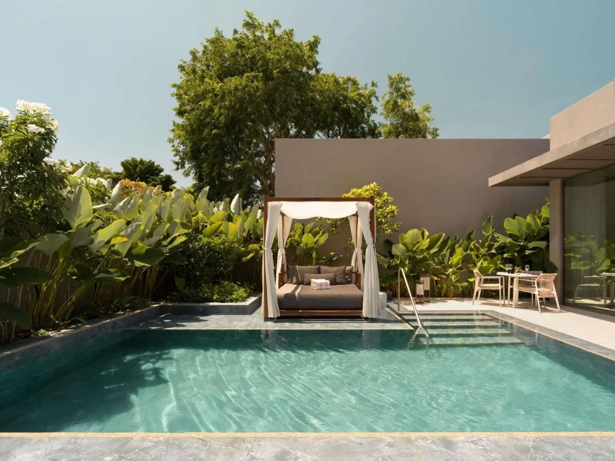 Outdoor Swimming Pool Area with Daybed and Seating on Sentosa Island