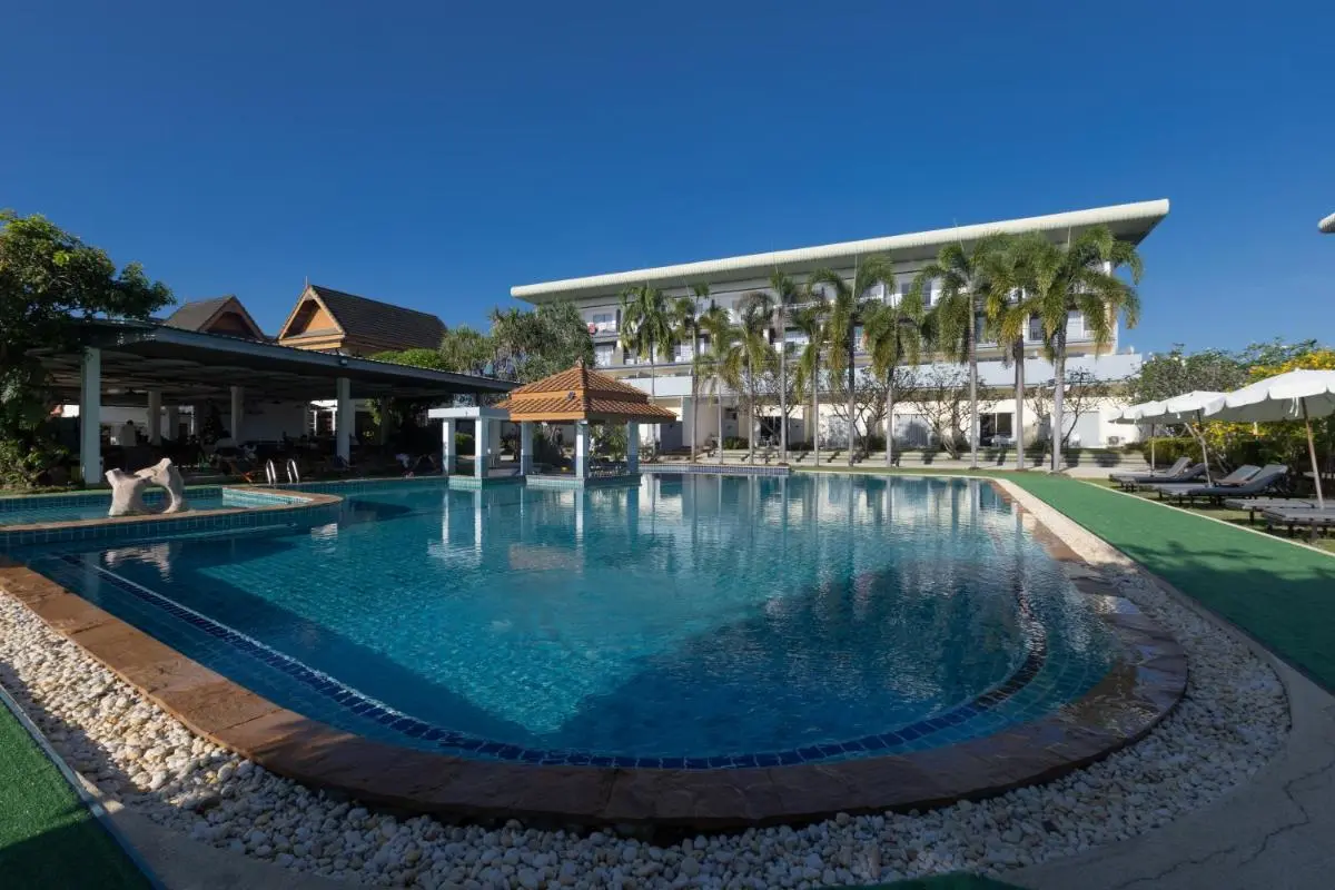 Outdoor Swimming Pool Area with Jacuzzi and Lounge Seating at Rawai Beach