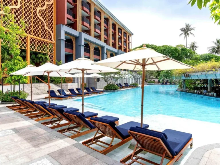 Outdoor Swimming Pool Area with Lounge Chairs and Pergola at Karon Beach