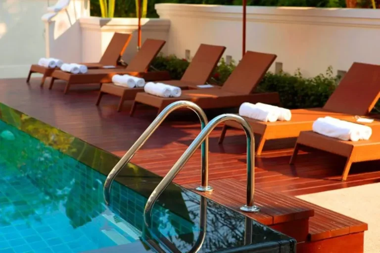 Outdoor Swimming Pool Area with Lounge Chairs and Tiled Pool in Chang Khlan Chiang Mai