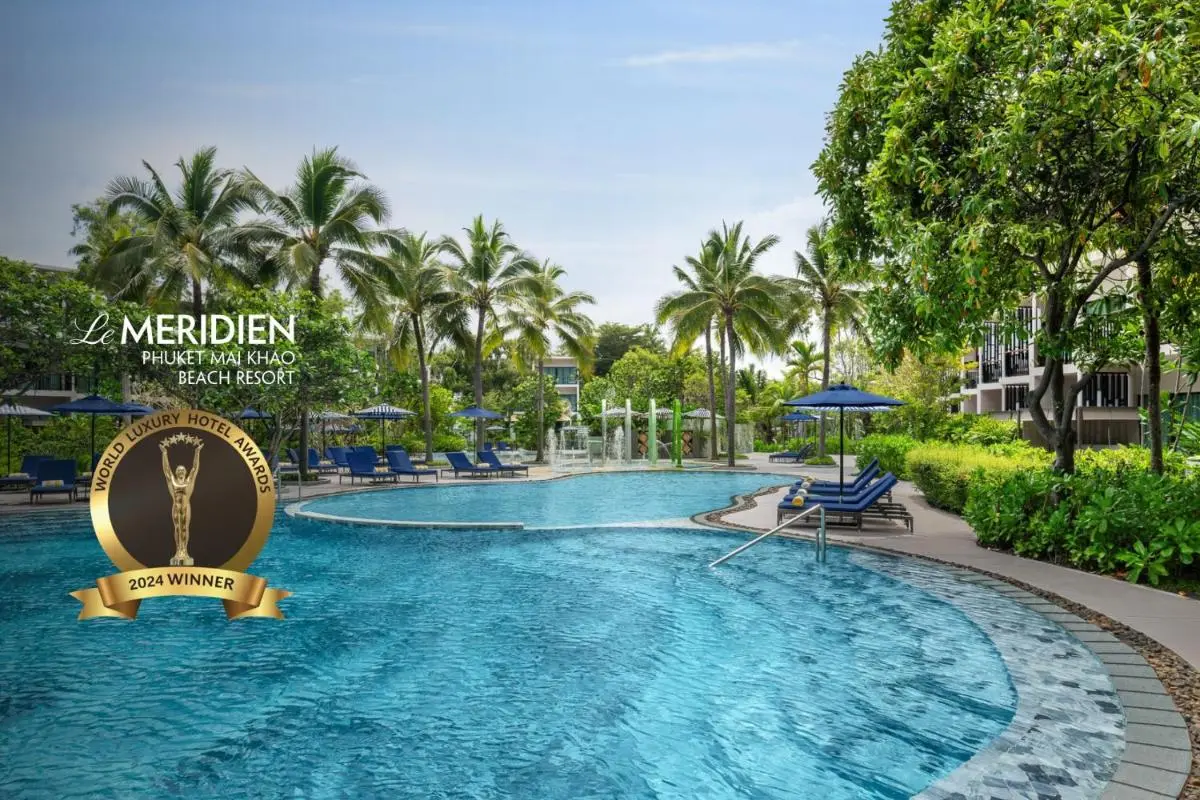 Outdoor Swimming Pool Area with Lounge Chairs and Water Features at Mai Khao Beach Resort