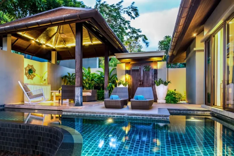 Outdoor Swimming Pool Area with Lounge Seating and Pavilion at Nai Thon Beach