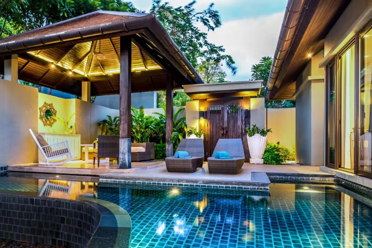 Outdoor Swimming Pool Area with Lounge Seating and Pavilion at Nai Thon Beach