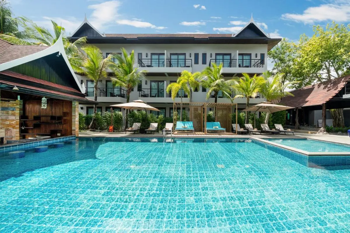 Outdoor Swimming Pool Area with Lounge Seating and Pergola in Thalang