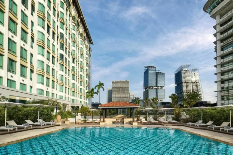 Outdoor Swimming Pool Area with Pavilion and Sun Loungers in Singapore City