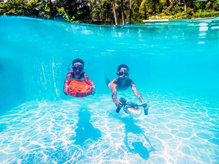 Outdoor Swimming Pool with Children Using Underwater Propulsion Devices at Kata Beach