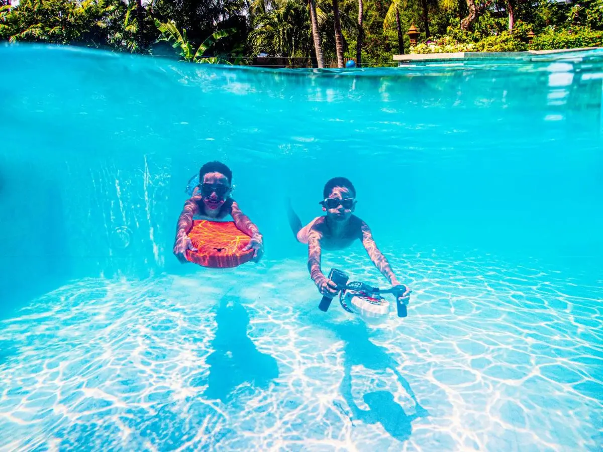 Outdoor Swimming Pool with Children Using Underwater Propulsion Devices at Kata Beach