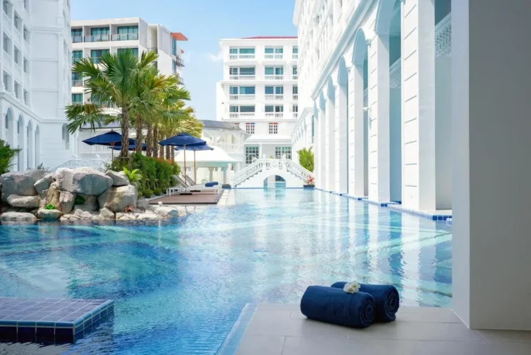 Outdoor Swimming Pool with Classical Architecture and Tropical Landscaping at Patong Beach