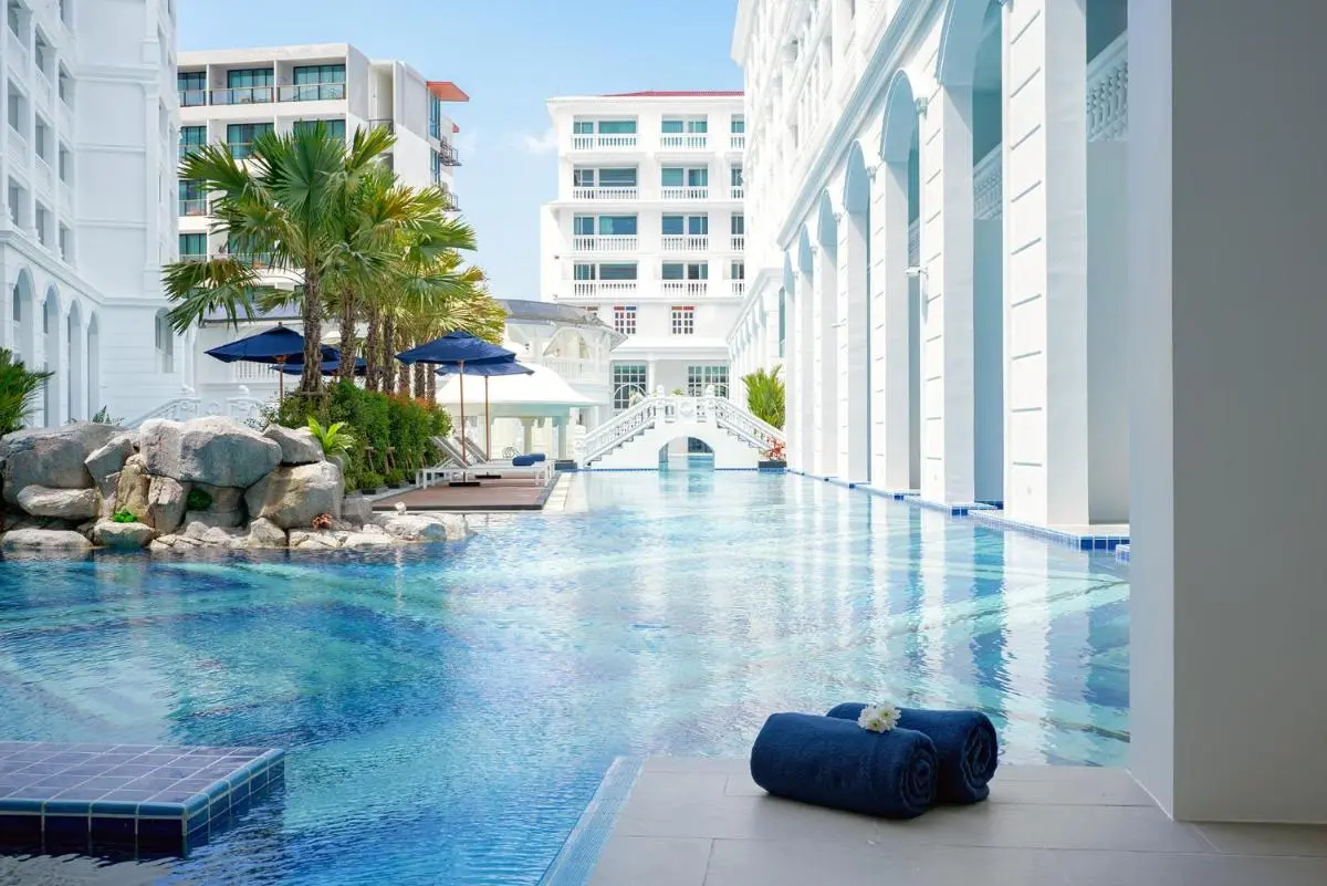 Outdoor Swimming Pool with Classical Architecture and Tropical Landscaping at Patong Beach