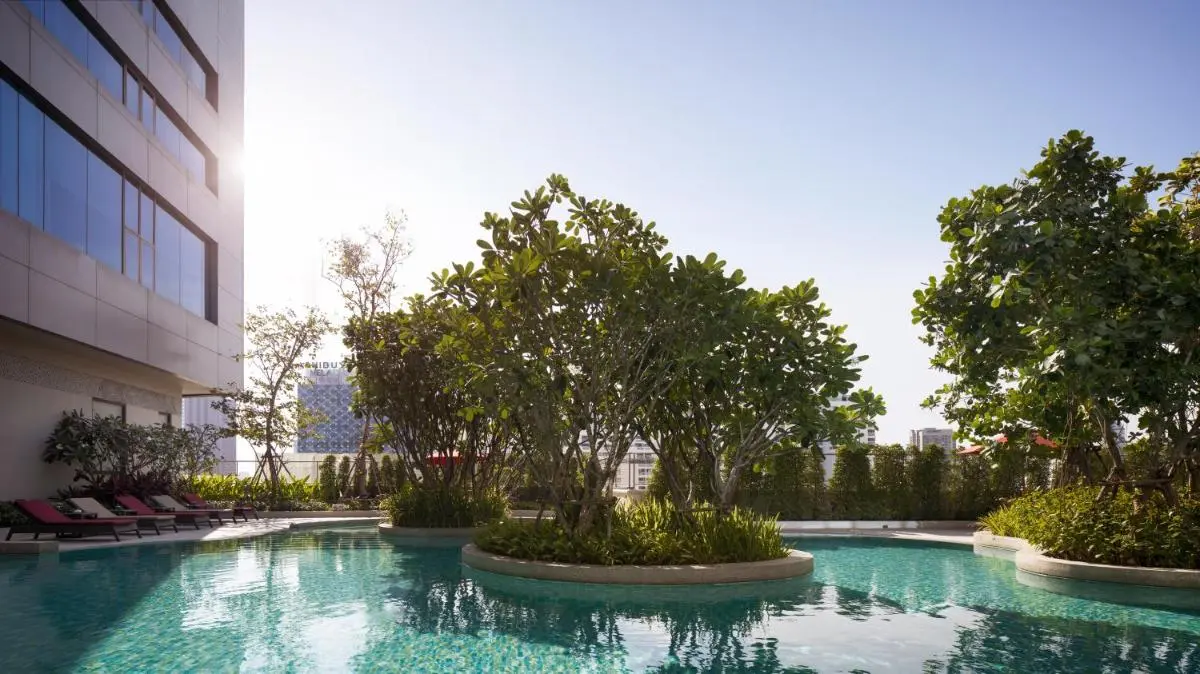 Bangkok Province Outdoor Swimming Pool with Curved Islands and Lounge Seating in Ratchathewi Bangkok