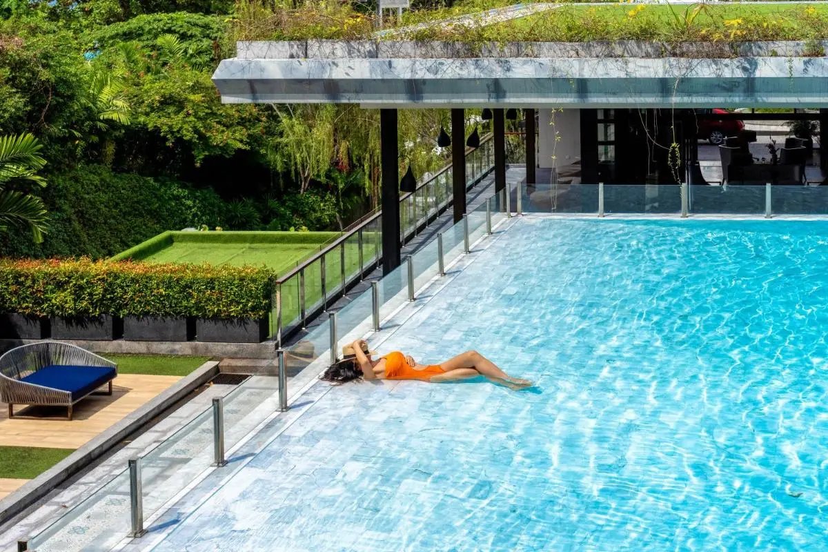 Outdoor Swimming Pool with Lounge Area and Green Roof at Karon Beach