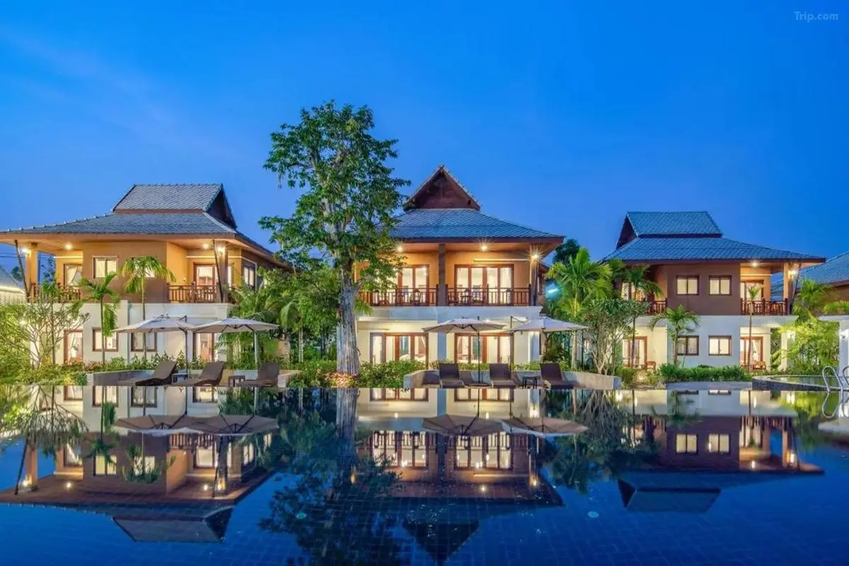 Outdoor Swimming Pool with Lounge Area and Modern Buildings in Chiang Mai