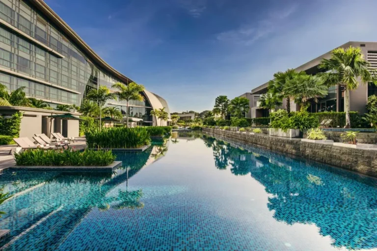 Outdoor Swimming Pool with Lounge Area and Tropical Landscaping in Singapore