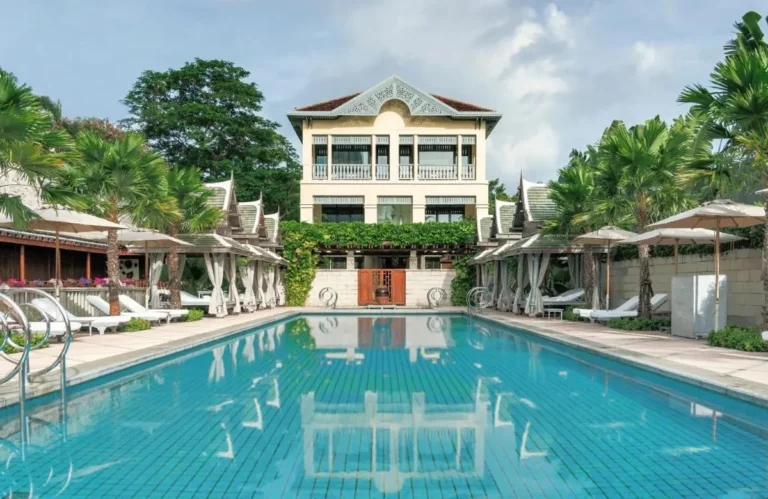 Outdoor Swimming Pool with Lounge Chairs and Cabanas in Khlong San Area