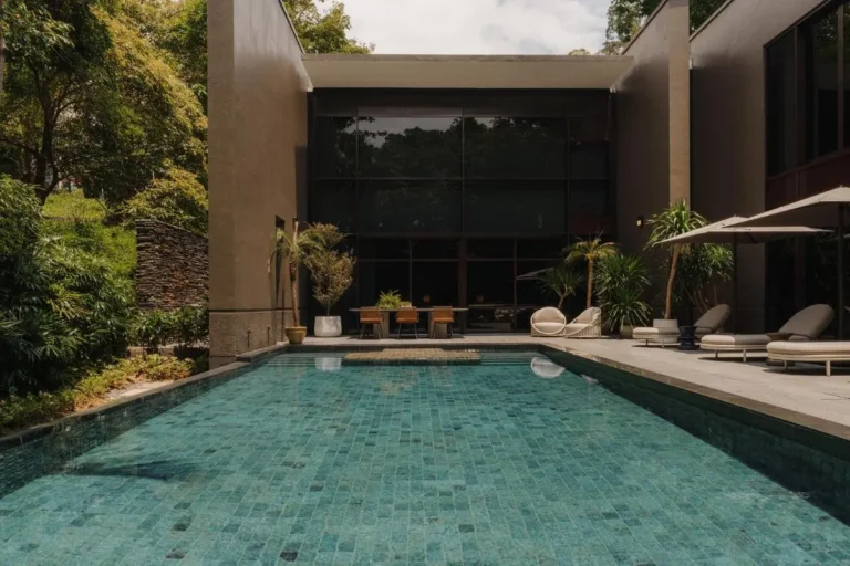 Outdoor Swimming Pool with Lounge Chairs and Dining Area on Sentosa Island