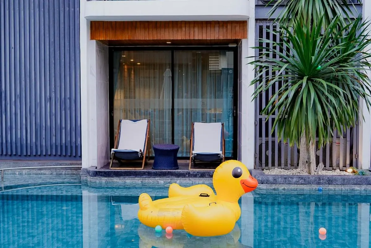 Wintree City Resort Chiang Mai Outdoor Swimming Pool with Lounge Chairs and Inflatable Duck in Chang Phueak Chiang Mai