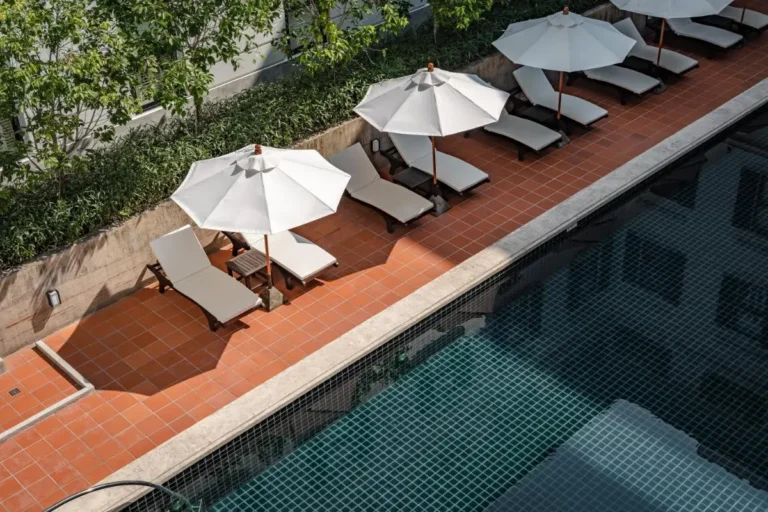 Outdoor Swimming Pool with Lounge Chairs and Umbrellas in Chang Phueak Chiang Mai
