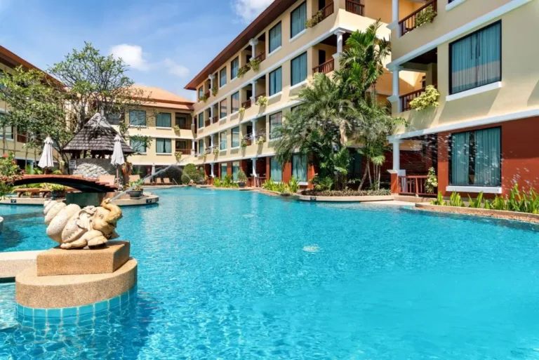 Outdoor Swimming Pool with Stone Elephant Sculpture and Thatched Gazebo at Patong Beach