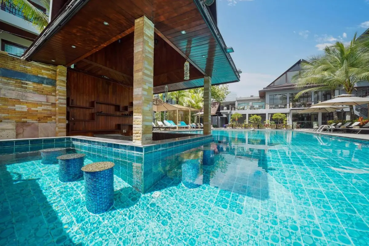 Outdoor Swimming Pool with Swim-Up Bar and Lounge Area in Thalang