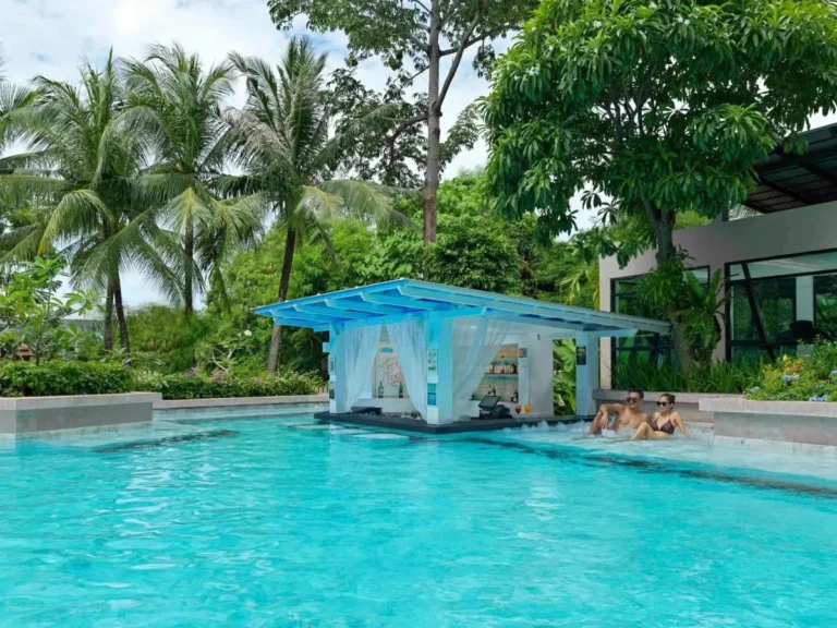 Outdoor Swimming Pool with Swim-Up Bar and Tropical Surroundings at Kata Beach