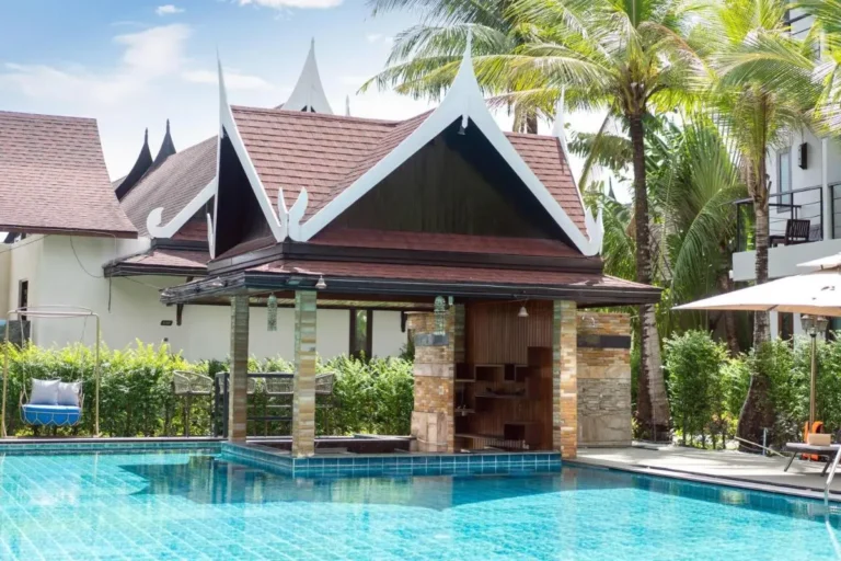 Outdoor Swimming Pool with Traditional Pavilion and Tropical Surroundings in Thalang