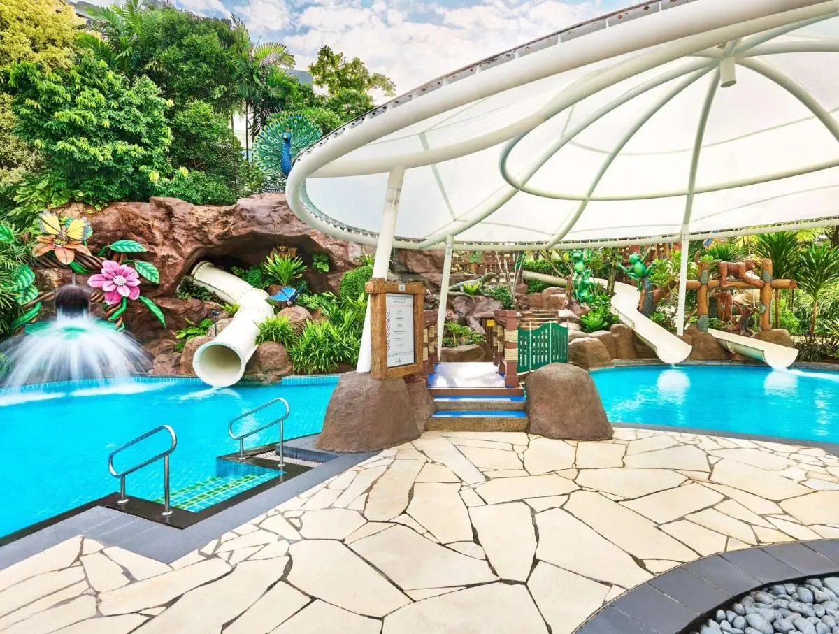 Outdoor Swimming Pool with Water Slides and Shade Structure in Singapore
